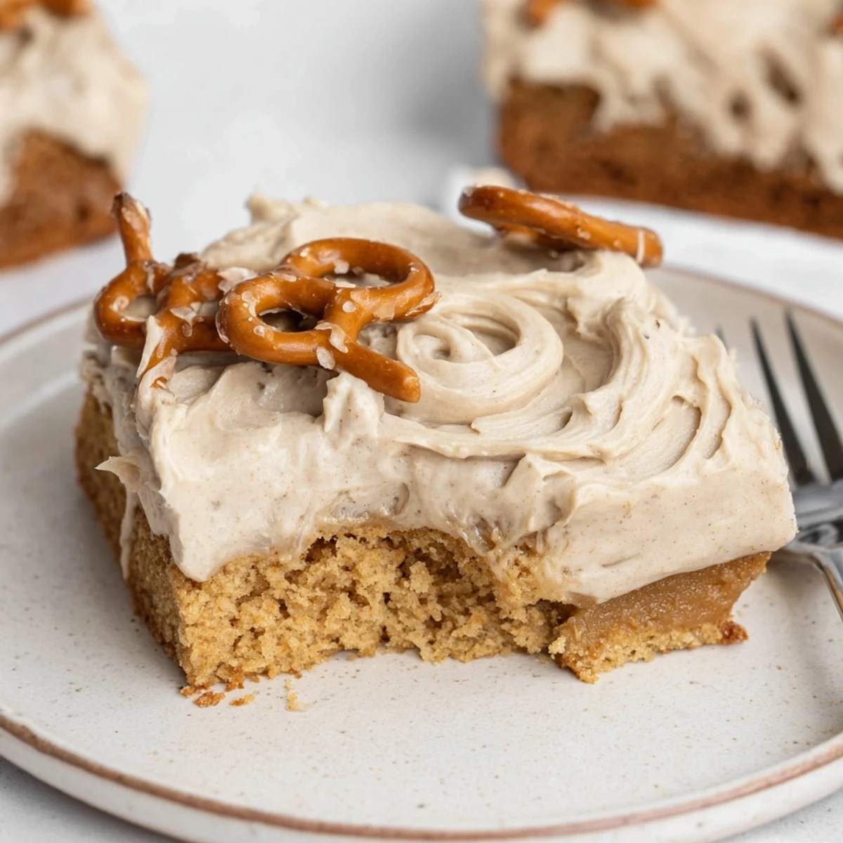 Indulge in this Root Beer Pretzel Cinnamon Sheet Cake, topped with creamy frosting.  