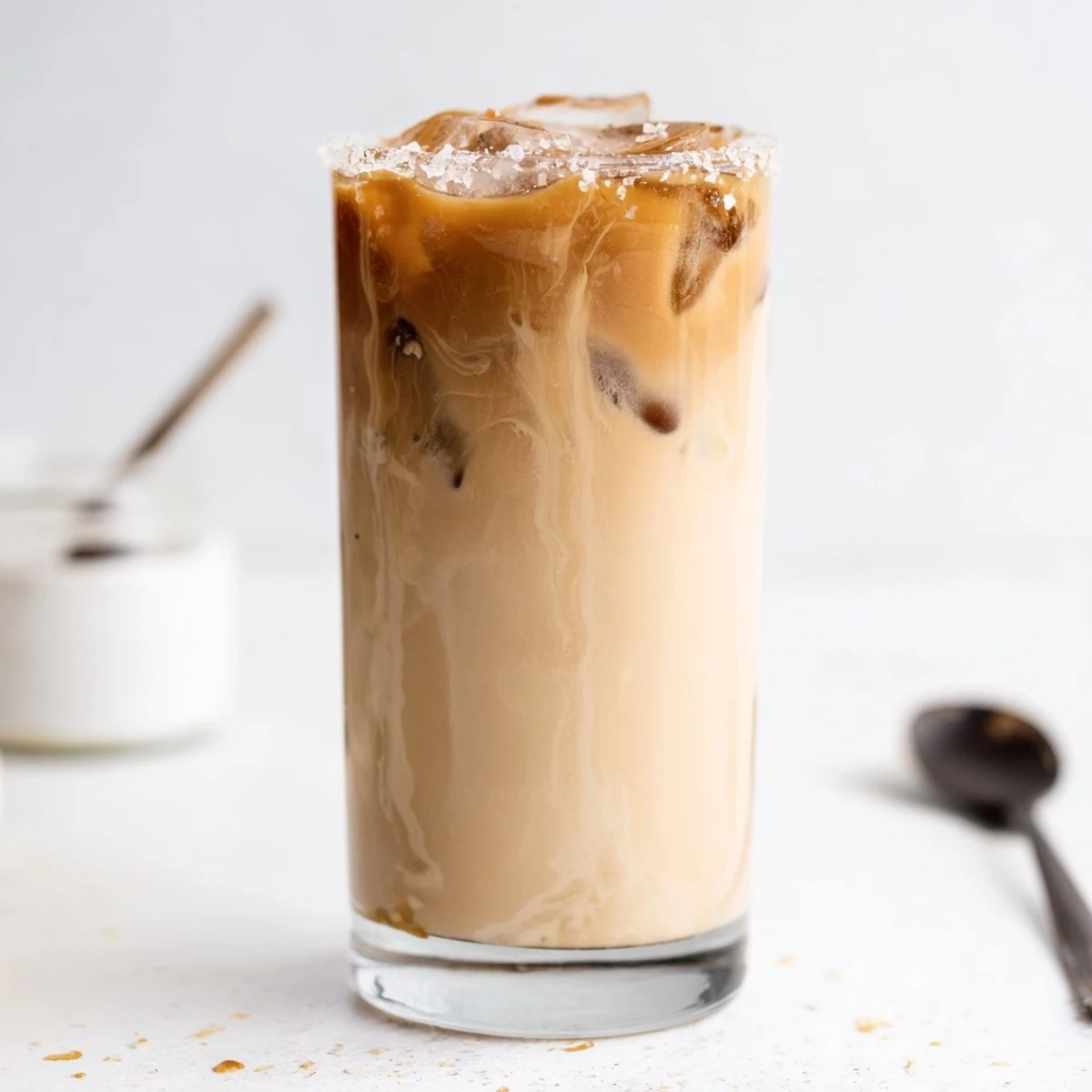 Creamy Tahini Iced Coffee topped with plant-based milk for a refreshing sip.  