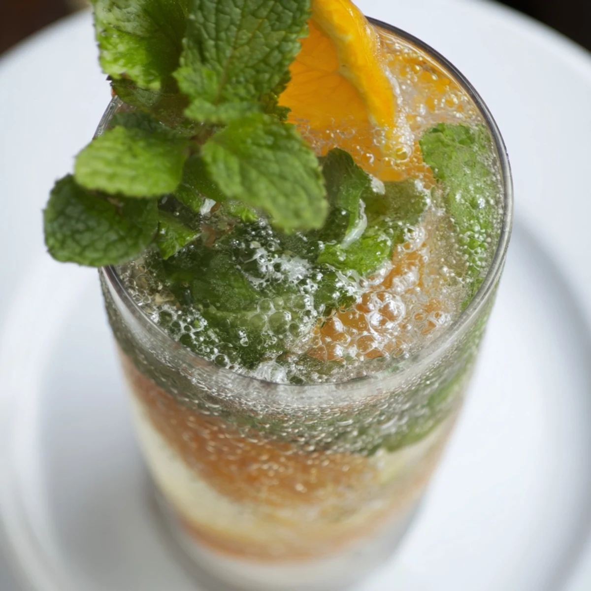 Homemade probiotic soda mocktail served over ice for a vibrant summer drink.  