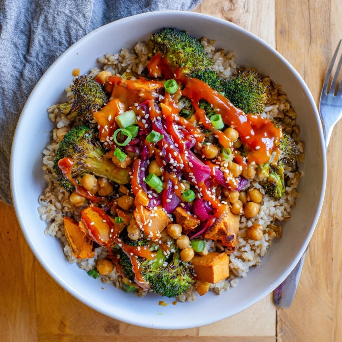 Vibrant Bold Sauce Drizzle Bowls topped with colorful roasted vegetables and chickpeas.  