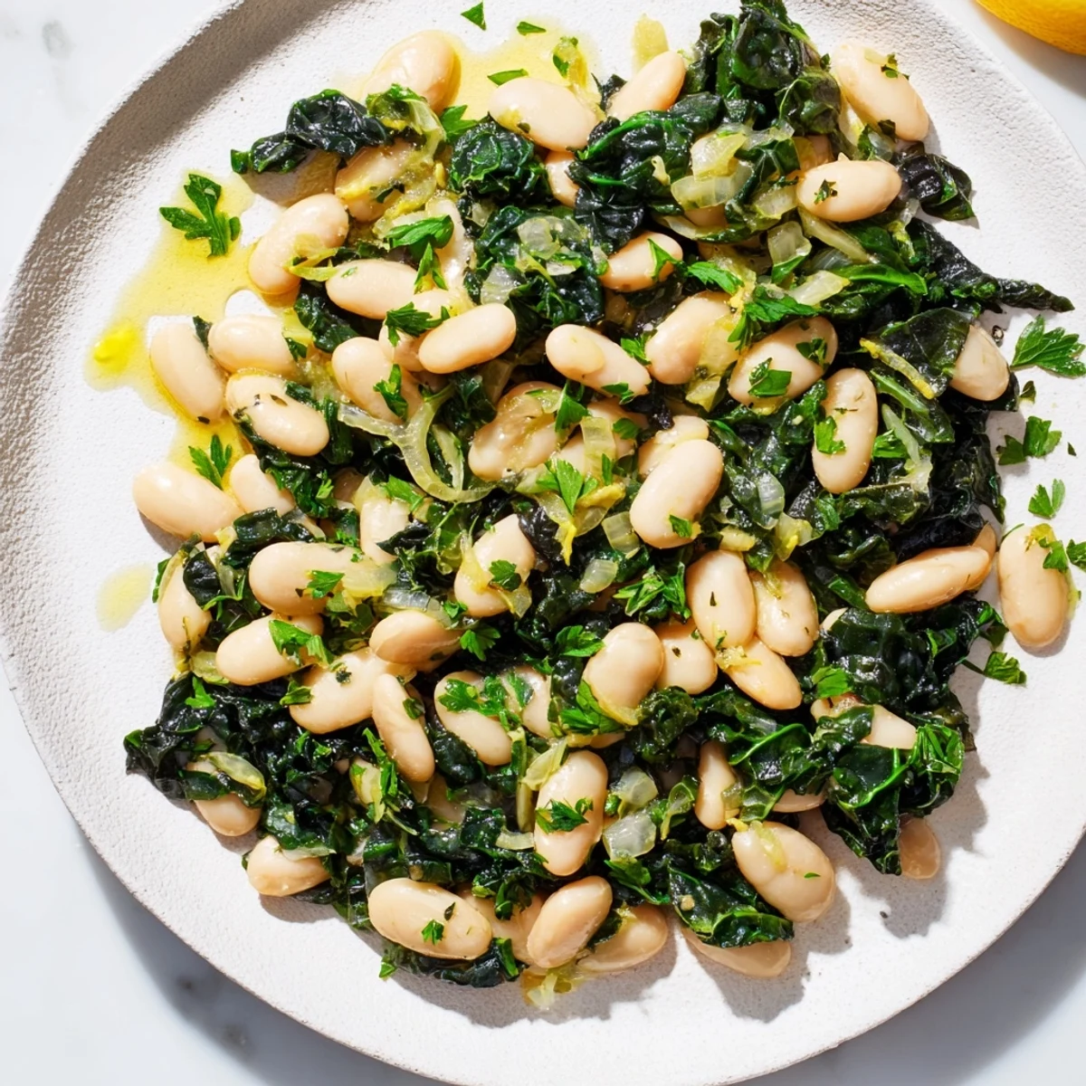 Close-up of Garlicky Beans with Winter Greens, showing vibrant green leaves and a flavorful, satisfying meal.
