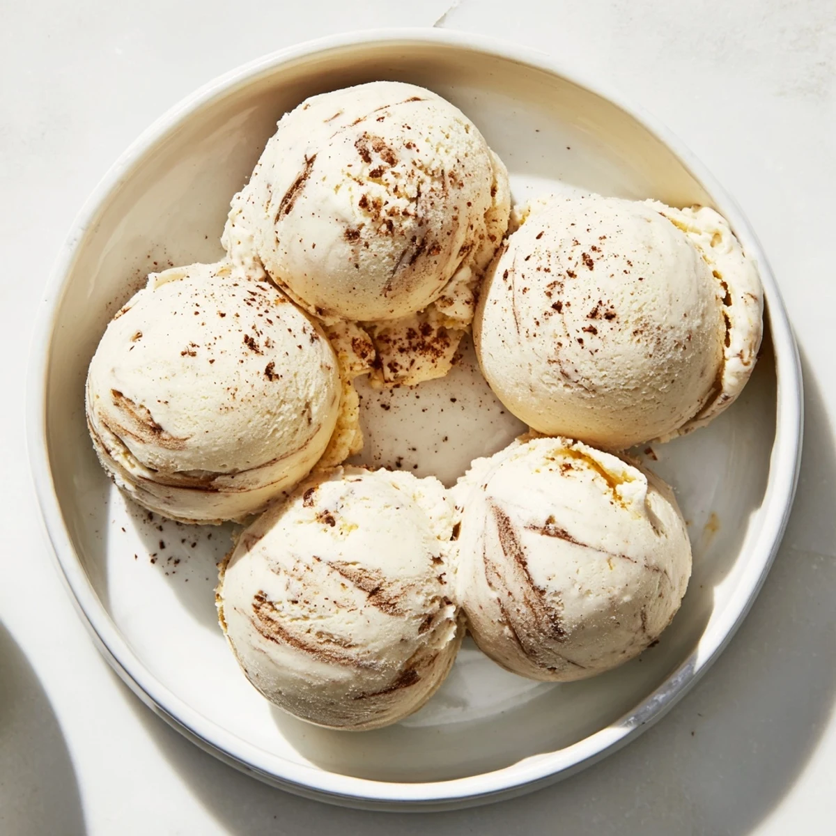 Scoops of homemade peanut butter banana ice cream ready to enjoy with a perfect texture.