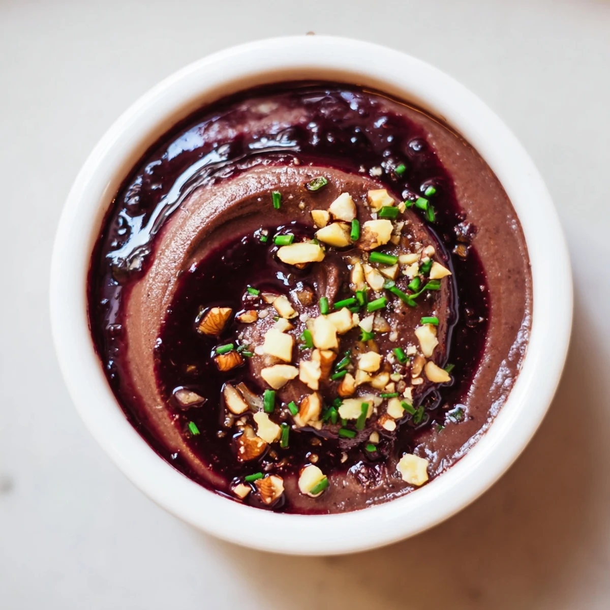 Delightful close-up of The Velvet Underground appetizer with smooth pâté, vibrant jams, and toasted nuts.