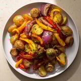 Golden roasted potatoes and Italian sausage shine in this Sheet-Pan Sausage with Peppers and onions dish.