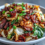 Savory skillet-fried cabbage, bacon, and onions ready to serve.