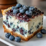Delicious No-Bake Lemon Blueberry Cheesecake Bars, perfect for summer dessert.