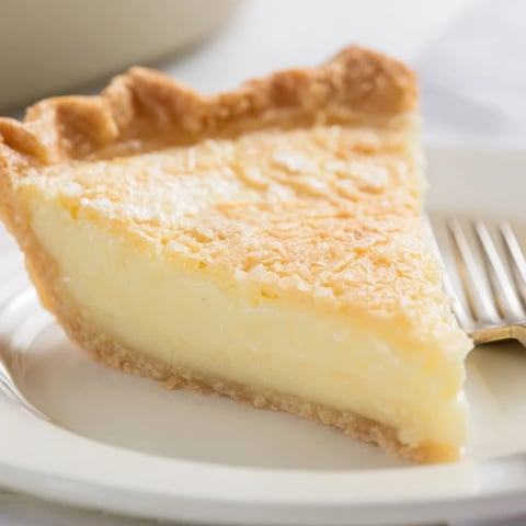 Creamy water pie resting in a golden crust, perfect for nostalgic dessert lovers.  