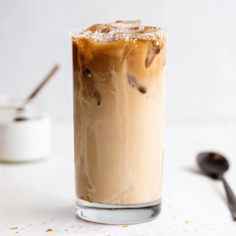 Creamy Tahini Iced Coffee topped with plant-based milk for a refreshing sip.  