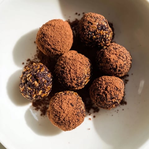 Creamy Date & Walnut Truffles rolled in cocoa powder, offering a rich, naturally sweet bite.