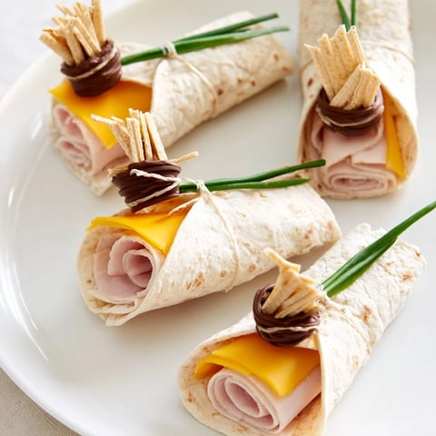 Graduation Cap Diploma Snack Wraps on a platter, ready to serve and celebrate graduation day.