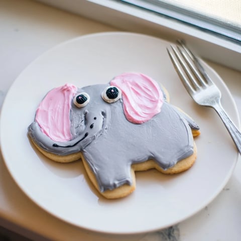 Giant Biscuits Amical Éléphant Géant, frosted gray with pink ears, make a fun party dessert.