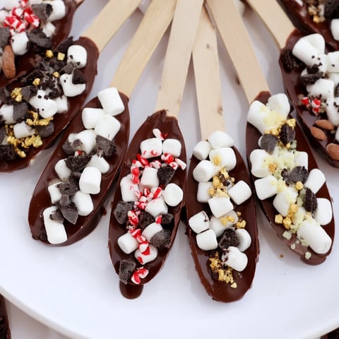 A beautiful Hot Chocolate Spoon Toppings board with colorful marshmallows and chocolate chips readily displayed.