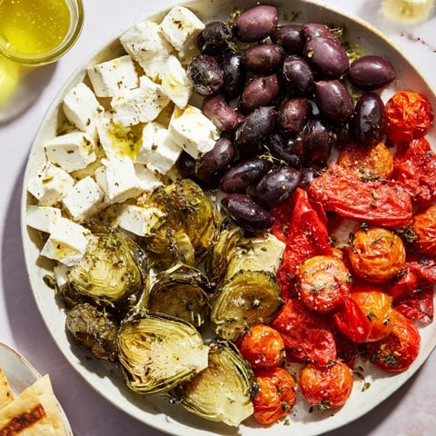 A beautiful Black Olive and Sun-Dried Tomato Platter awaits, offering a medley of Mediterranean flavors.