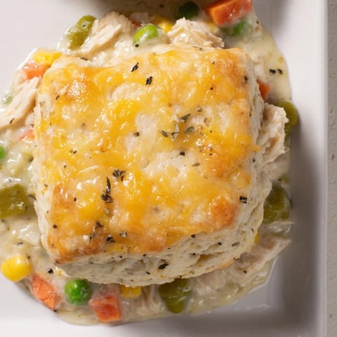 Chicken Cobbler with Red Lobster Mix: a bubbly casserole featuring a golden biscuit topping and creamy chicken filling.