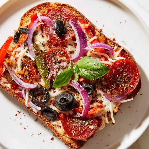 Golden, bubbly Pizza Toast 2.0 with melting mozzarella and savory pepperoni on thick sourdough.