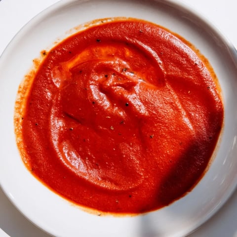 Instant Creamy Marinara Hack simmering in a saucepan, anticipating serving over pasta with a sprinkle of herbs.
