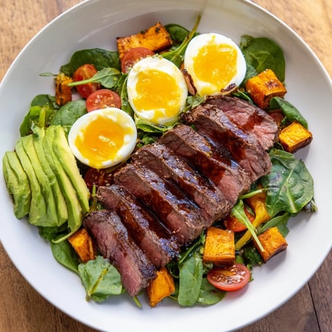 Tender beef slices grace this High-Protein Beef Avocado Bowl, alongside creamy avocado and roasted sweet potato.