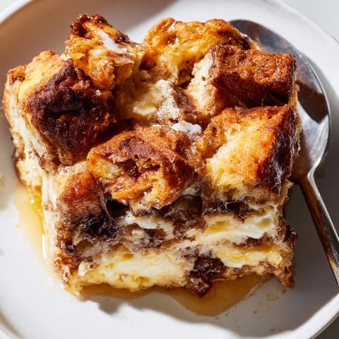 Warm, spiced Cinnamon Vanilla Bread Pudding with a soft center, a homestyle dessert.