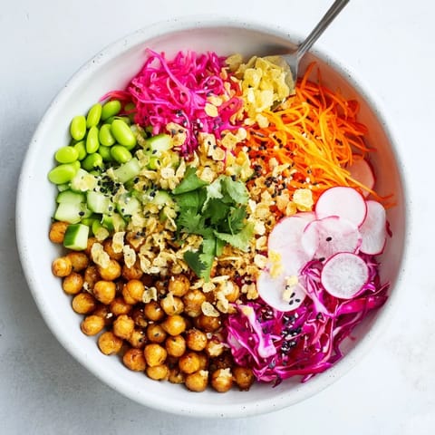 Vibrant ASMR Crunch Snack Bowls topped with roasted chickpeas and crispy rice puffs.  