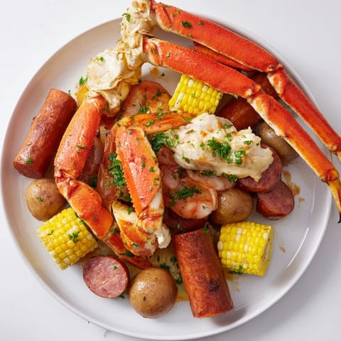 A vibrant close-up showing a seafood boil with crab, shrimp, and sausage, perfectly spiced and flavorful.