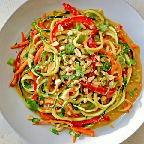 Cool and refreshing zesty peanut zucchini noodles, perfect for a light, healthy lunch or side dish.