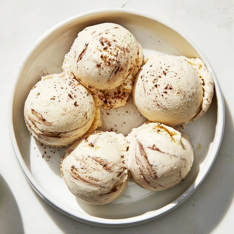 Scoops of homemade peanut butter banana ice cream ready to enjoy with a perfect texture.
