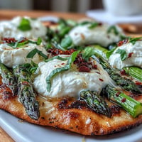 Vibrant Roasted Asparagus Flatbread with creamy burrata and bright lemon zest toppings.